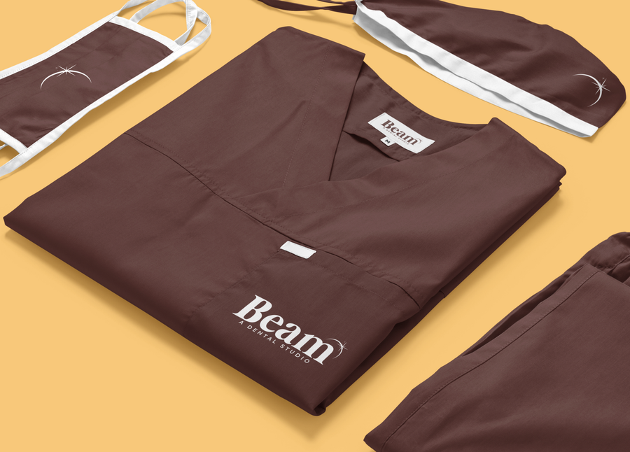 Beam branded scrubs, showing the logotype applied to studio apparel