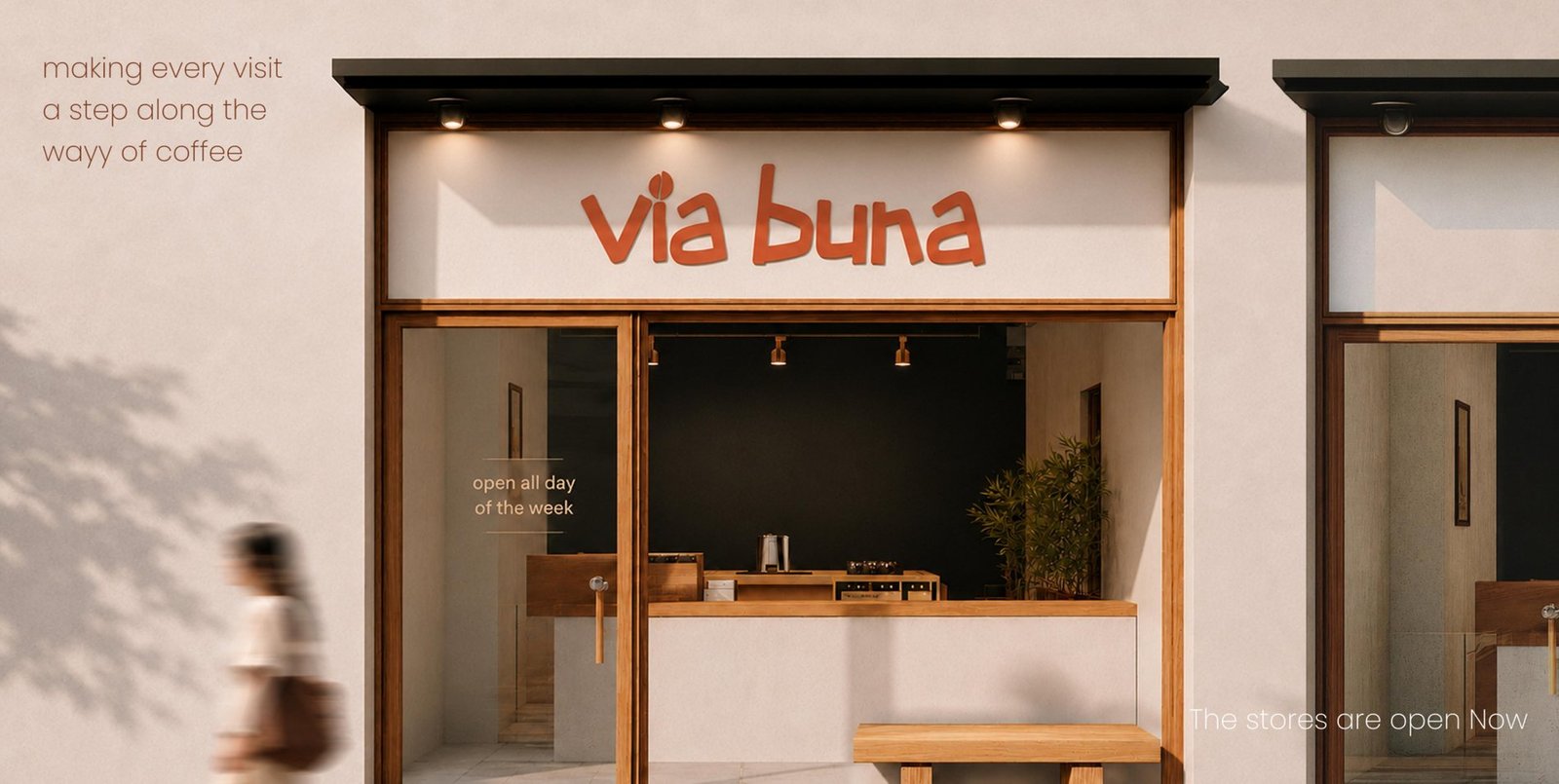 Via Buna storefront with hand-lettered signage above a warm wooden coffee counter