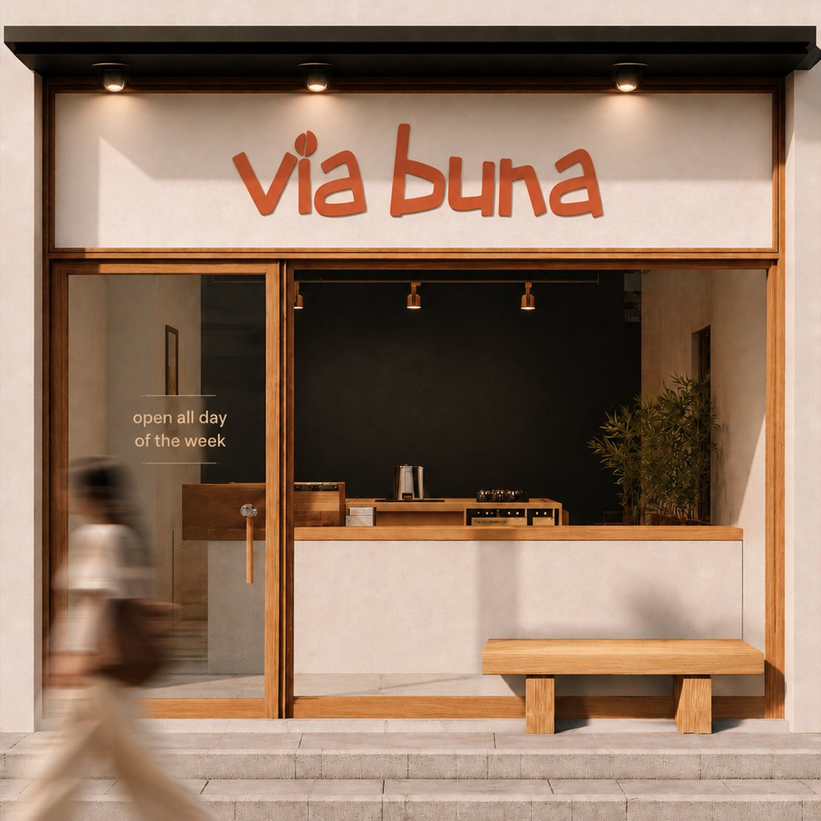 Via Buna storefront exterior with hand-lettered rust orange signage